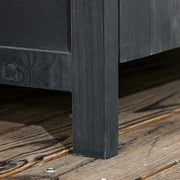 Close-up of one raised wooden leg holding the shed base clear of the decking