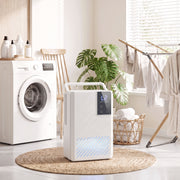 HOMCOM white dehumidifier lifestyle shot in a laundry room beside a washing machine and drying rack