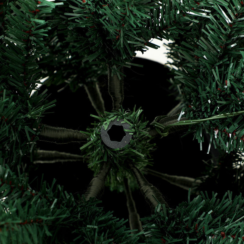 Close-up underneath the tree showing the central trunk and branch supports