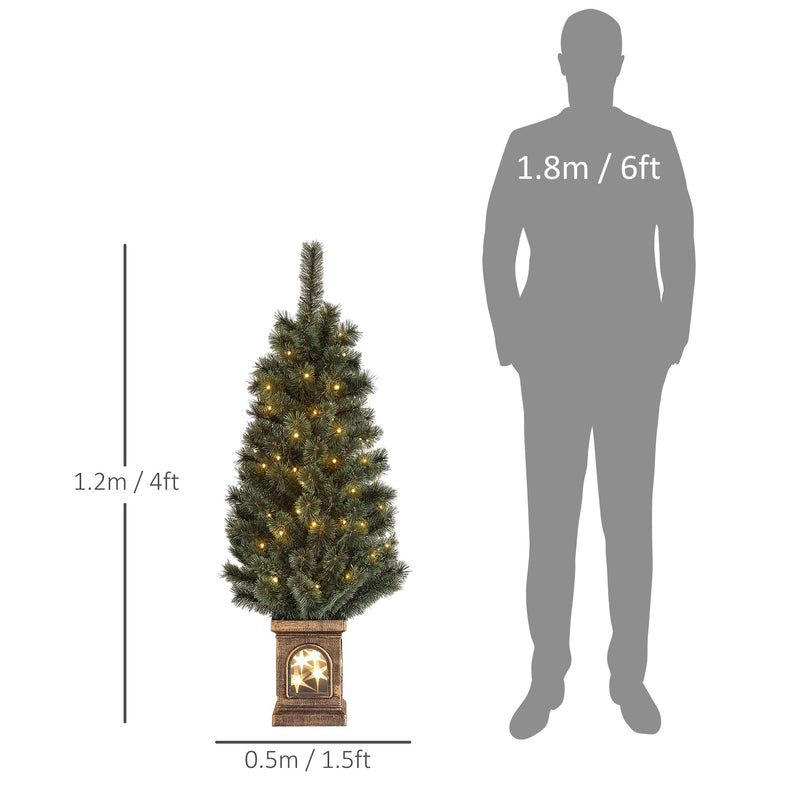 4ft Christmas tree with 1.2 m height and 0.5 m base width beside a person silhouette