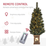 Lit Christmas tree with remote control and icons for brightness, timer and modes