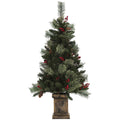 Studio shot of a 4ft green Christmas tree with red berries and pine cones in a bronze retro base