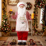 Chef Santa figure in a festive room with a wreath and gifts