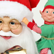 Close-up of the green elf on Santa's shoulder and his gold-rimmed glasses