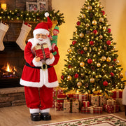 Santa figure beside a fireplace and decorated Christmas tree with gifts