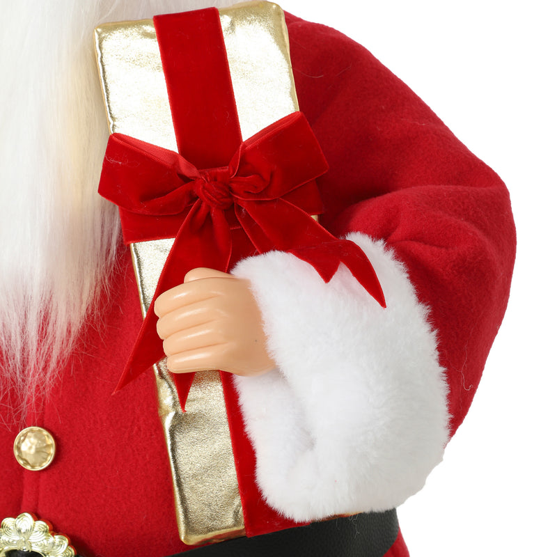 Close-up of Santa's gold-tone gift box with red velvet bow