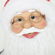 Close-up of Santa's face with gold-rimmed glasses and white beard