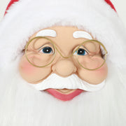 Close-up of Santa's face with round gold glasses and white beard