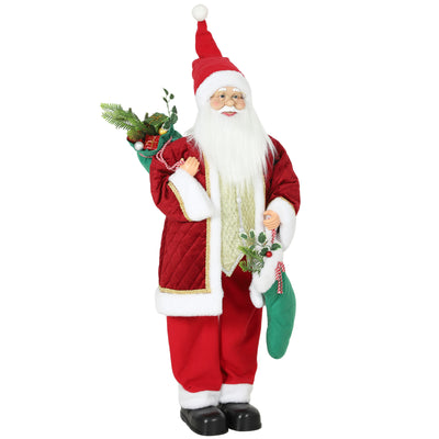 Red Santa Claus figure with pale vest with gold trim and green stocking on a white background