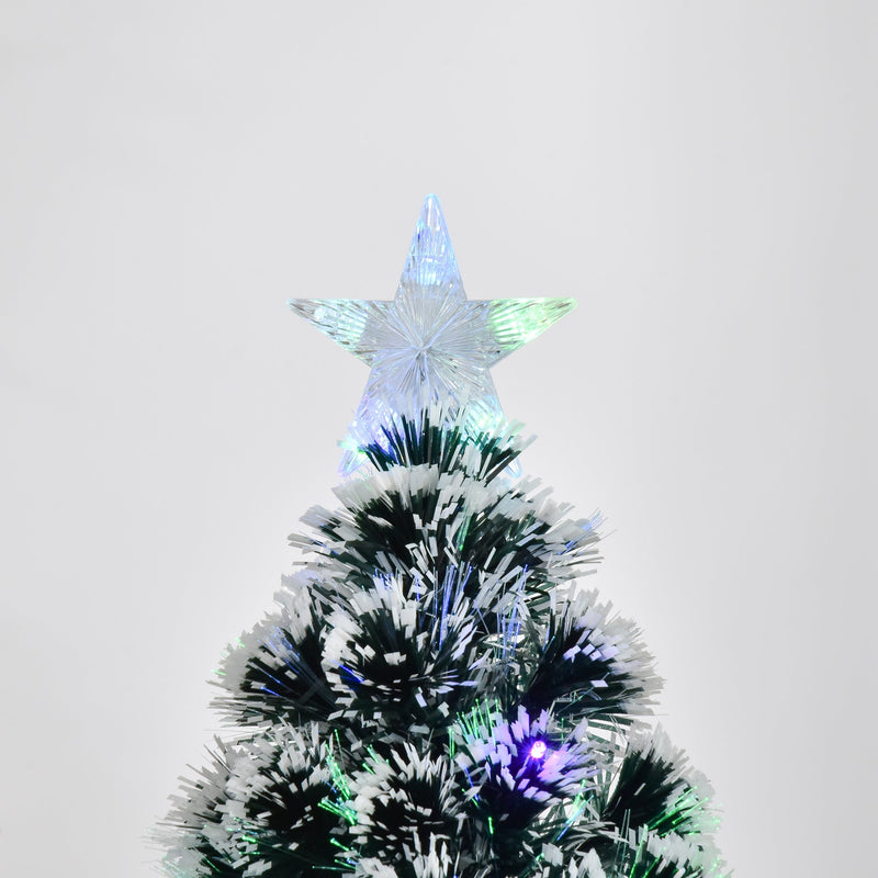 Close-up of the star tree topper above white-tipped branches