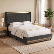 Double ottoman bed frame made up with bedding and cushions in a bedroom