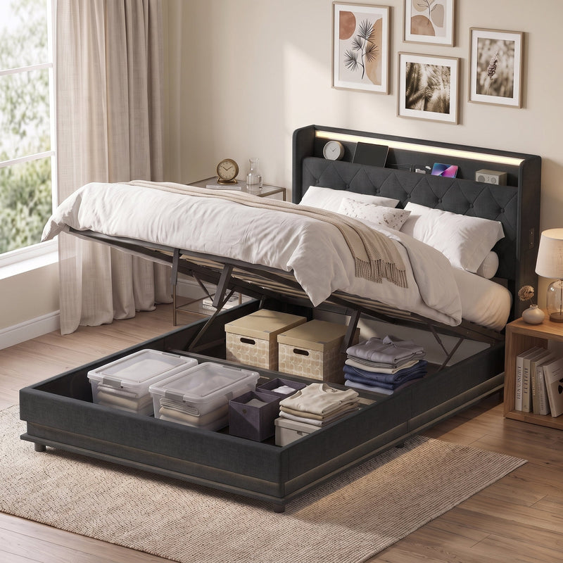 Double ottoman bed with the base raised revealing storage boxes and baskets