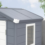 Close-up of the apex roof panels, white corner caps and the window frame