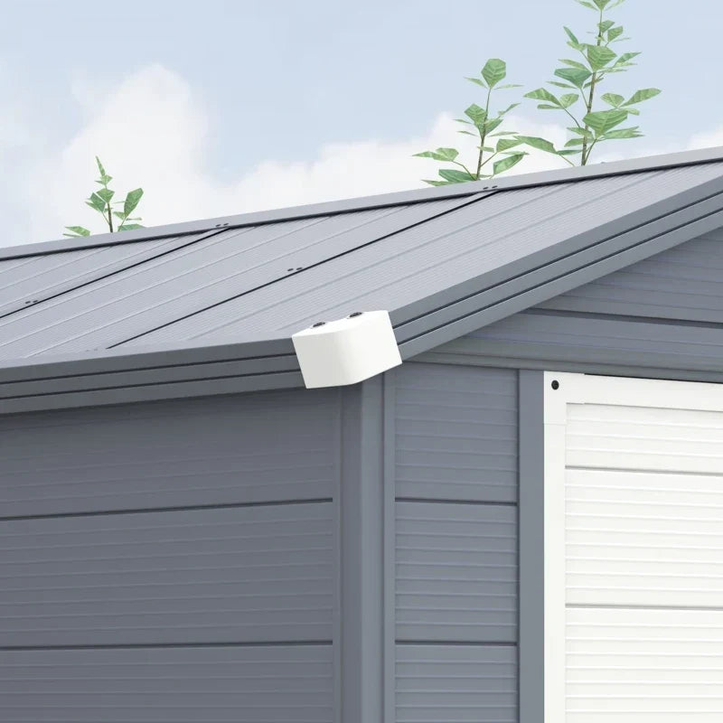Close-up of the apex roof ridge panels and the white gable vent