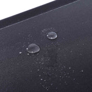 Water droplets beading on the surface of the black non-woven fabric panel