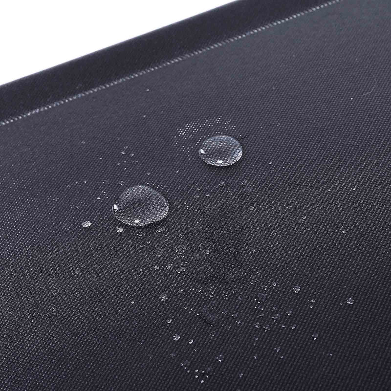 Water droplets beading on the surface of the black non-woven fabric panel