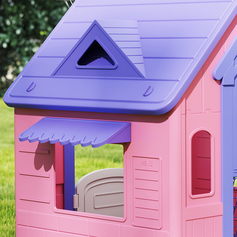 Close-up of the playhouse's triangular roof vent, window awning and wall panel detail