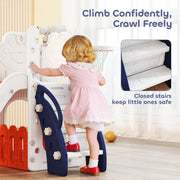 Toddler girl climbing the steps to reach the basketball hoop on the orange slide set