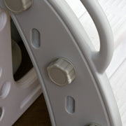 Close-up of a screw fixing point on the grey slide frame