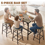 Family of four sitting at the bar table set during breakfast