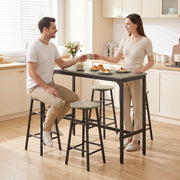 Couple sitting at the bar table sharing coffee in a kitchen
