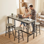Couple using the bar table as a laptop workspace at home