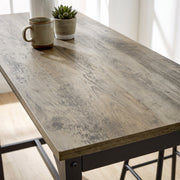 Close-up of the grey wood-effect tabletop finish