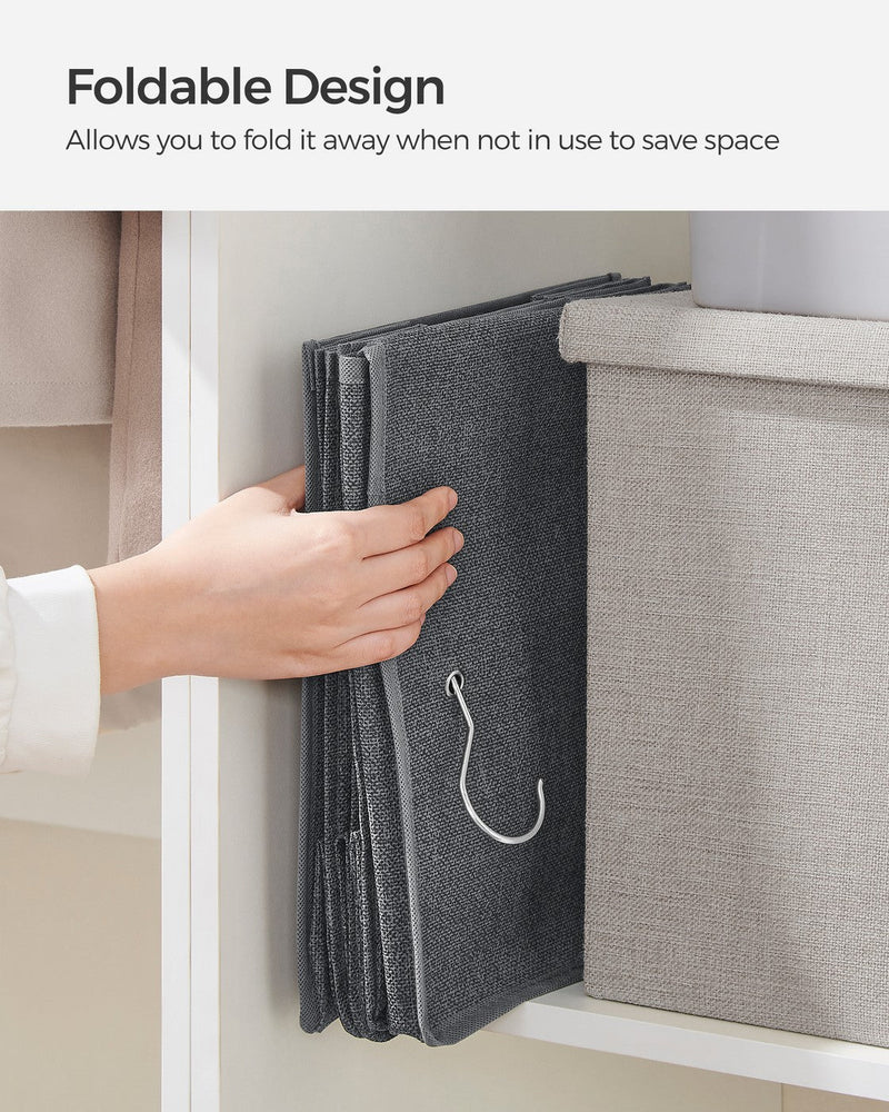 Foldable design panel showing a hand folding the grey organiser flat for storage