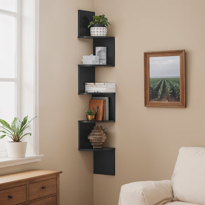 Black 5-tier zigzag corner wall shelf mounted in a living room corner with decor