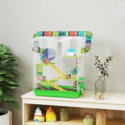 Green twin-roof hamster cage styled on a shelf with plants and jars