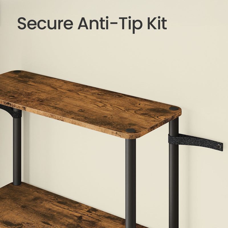 Close-up of the black anti-tip strap fixing the top shelf of the unit to the wall