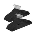 Two stacks of black velvet hangers with chrome hooks showing the ultra-thin flocked design