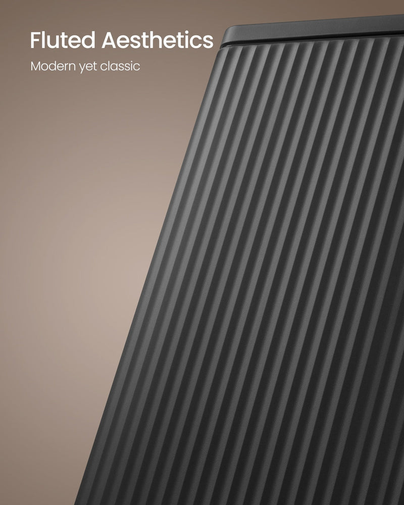 Close-up of the fluted lid corner on the black steel kitchen bin