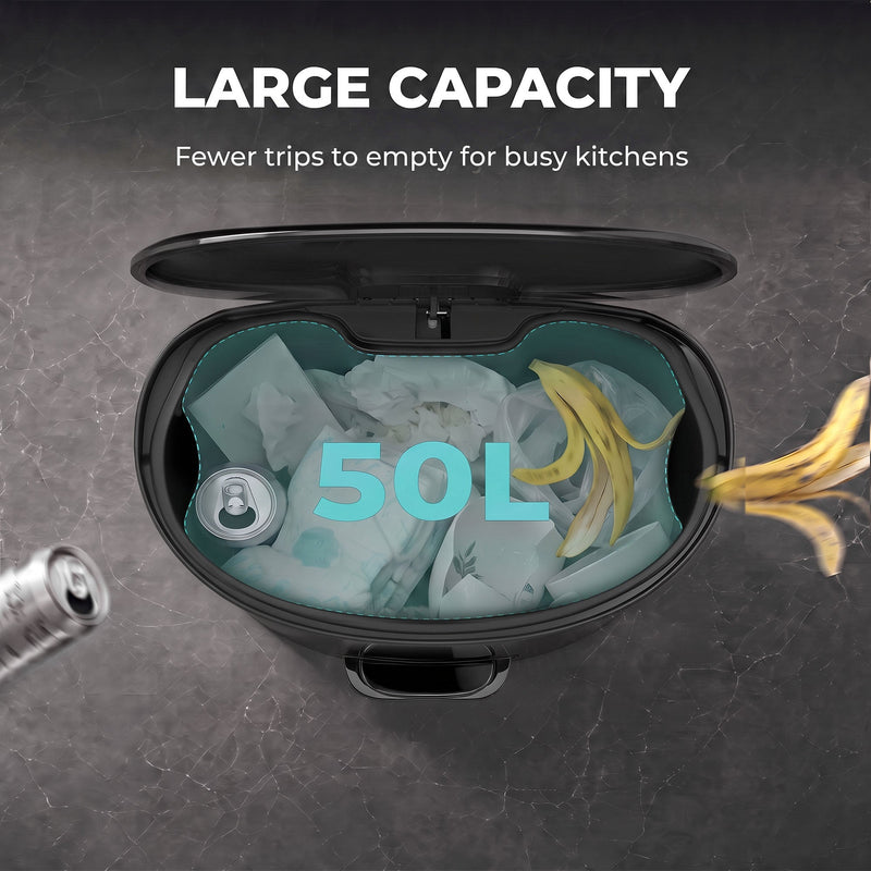 Overhead view of the open pedal bin bucket holding food waste, cans and bags