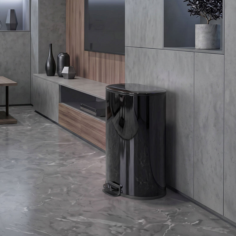 Black pedal bin standing in a living room beside a media unit