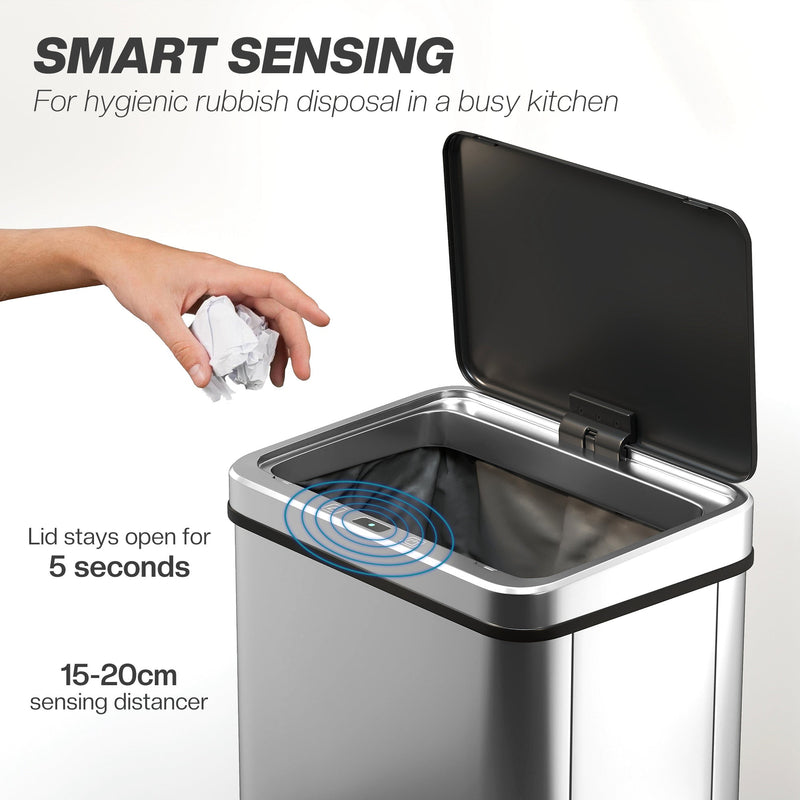 Hand dropping paper into the open sensor bin, which stays open for 5 seconds