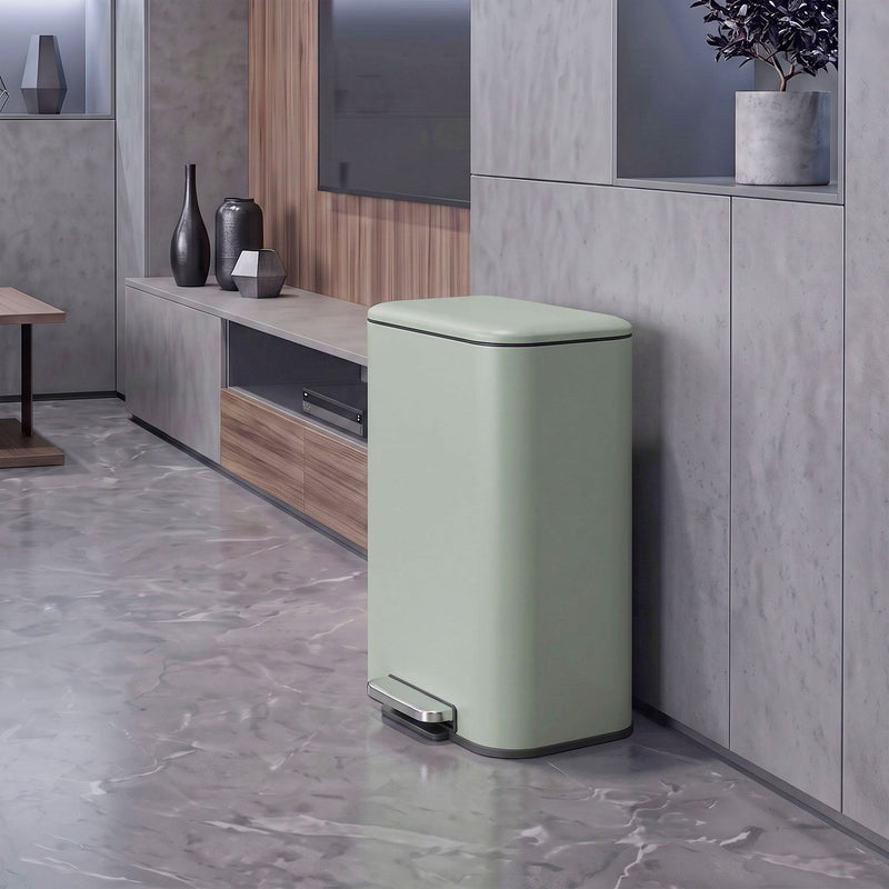 Light green 50L pedal bin standing beside a TV unit in a living room