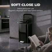 Soft-close lid graphic with a black pedal bin beside a woman reading on a sofa