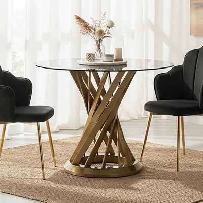 Black glass round dining table with gold hourglass base styled in a dining room setting