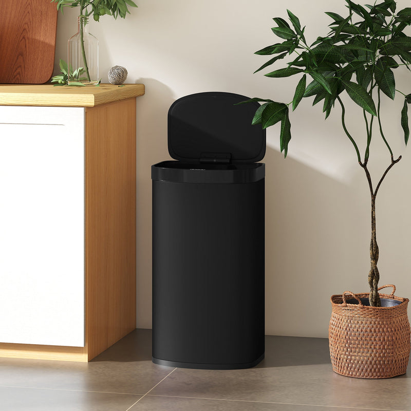 HOMCOM sensor bin in black placed in a hallway beside a wooden cabinet and plant