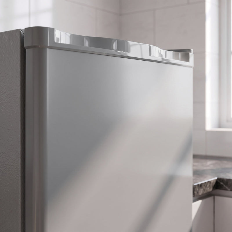 Close-up of the grey mini freezer's top edge and door
