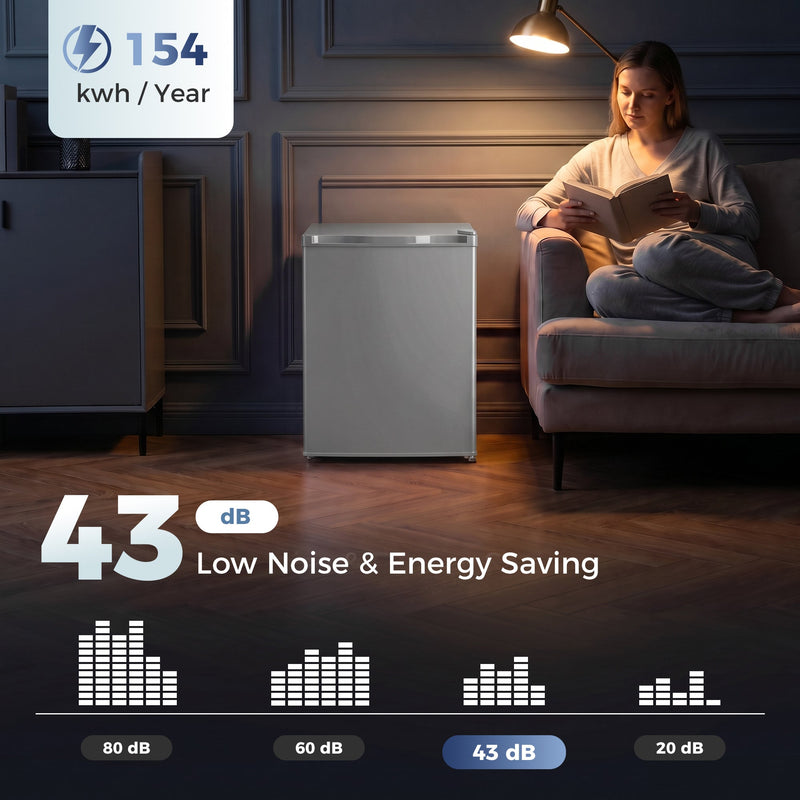 Grey mini freezer in a dim living room with 154 kWh per year and 43 dB noise infographic