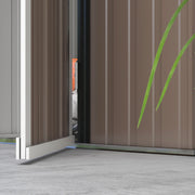 Close-up of the part-open door showing the brown grain-printed panels and door edge