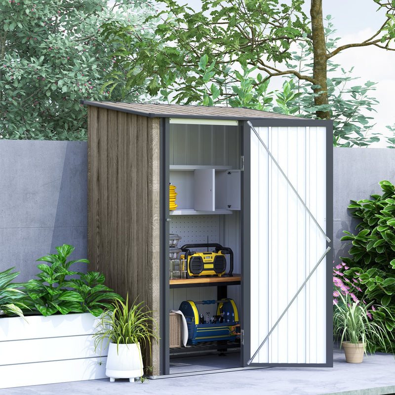 Shed against a grey wall with the door open showing shelves, a radio and power tools