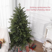 Green Christmas tree in a bright room with gifts and a striking centrepiece caption