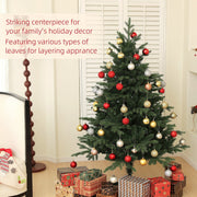 5ft spruce Christmas tree decorated with red, gold and silver baubles in a living room