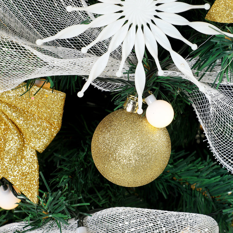 Close-up of a gold glitter bauble, white snowflake ornament, mesh ribbon and gold bow