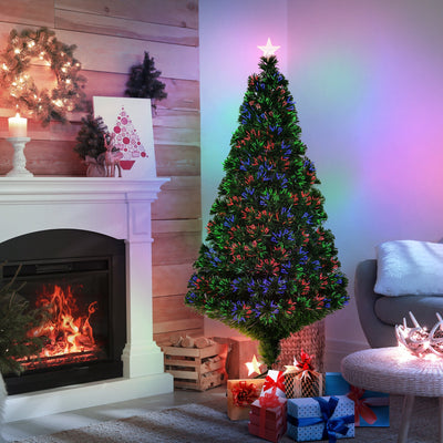 5ft fibre optic Christmas tree glowing with multicolour lights beside a fireplace, with gifts at its base