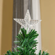 Close-up of the clear star topper above the green branches