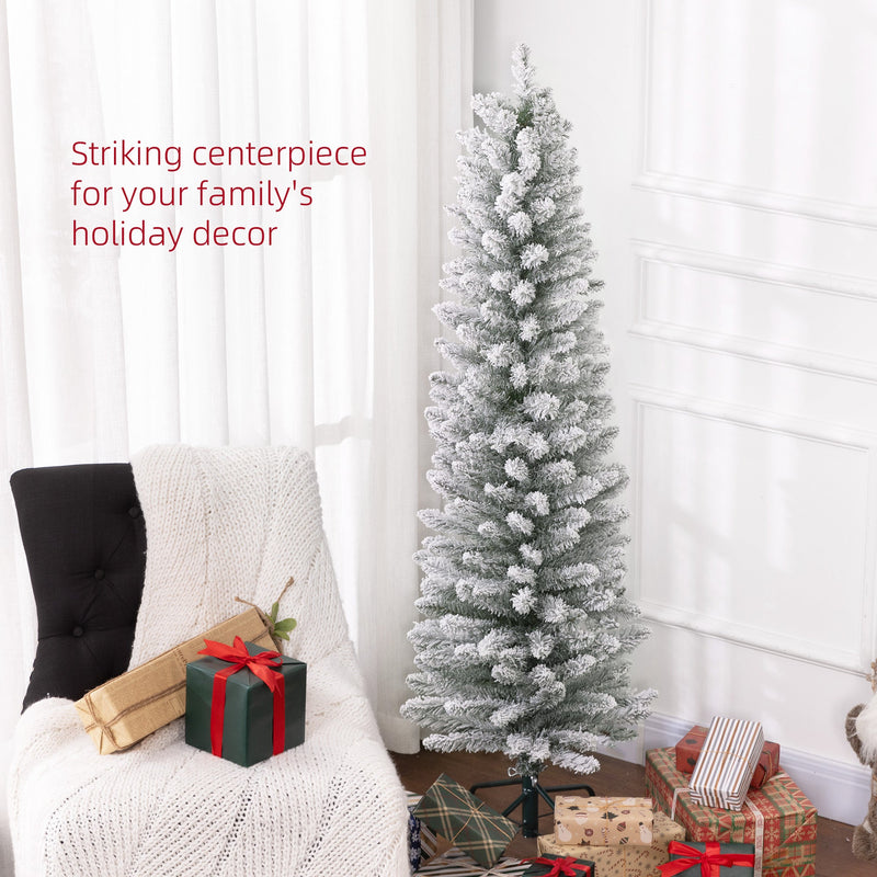 Snowy pencil Christmas tree beside a white armchair and gifts with a striking centrepiece caption